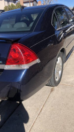 Midnight Blue 2010 Chevrolet Impala with 72,000 miles, featuring leather interior and new tires.