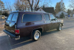 1991 GMC Suburban in excellent condition with a beautiful exterior and chrome accents parked outdoors.