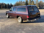 1991 GMC Suburban SLE with 61,000 miles, showcasing its classic design in great condition.
