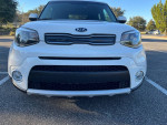 Front view of a white 2019 Kia Soul with a black grille and fog lights, available for sale.