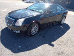 2012 Cadillac CTS in black, well-maintained, with new tires and sunroof, ready for a smooth ride.