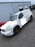 2010 Chevrolet HHR LS FWD, white delivery vehicle with 133,000 miles, as-is condition, seen from the side.