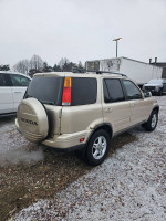 2001 Honda CR-V SE AWD parked, showcasing exterior condition and spare tire cover.