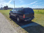 2006 GMC Yukon XL K1500 parked on grass showing rear and side view, 70,000 miles, cold AC, clean title.