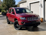 2014 Jeep Compass Latitude FWD in excellent condition parked in driveway with new front brakes and fresh oil change