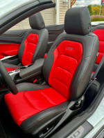 Interior of a 2023 Chevrolet Camaro 2SS Convertible featuring red and black leather seats.