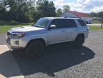 2023 Toyota 4Runner TRD Off-Road 4WD parked outside with a silver exterior and rugged tires