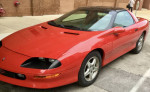 1997 Chevrolet Camaro RS in pristine red condition with T-tops and polished rims