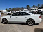 Side view of a clean 2013 Audi A8 luxury car with S8 appearance package, in excellent condition, parked outdoors.