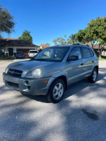 2008 Hyundai Tucson in excellent condition with clean title and new tires, parked outside