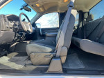 Interior of a 2007 GMC Sierra truck showcasing front and back seats.