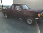 Maroon Ford Ranger XLT truck with new front brakes, great condition, parked outdoors.
