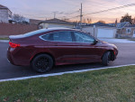 2015 Chrysler 200 Limited, maroon sedan parked with low mileage, featuring stylish design and modern amenities.