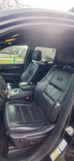 Interior view of 2015 Jeep Cherokee Sport FWD with leather seats and modern dashboard features