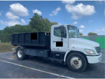 2007 Hino 268 medium duty truck with black dumpster, automatic transmission, and well-maintained features.