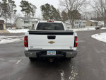 Rear view of a 2011 Chevrolet Silverado 1500 LTZ 4WD parked in snow, showcasing its clean design and sturdy build.