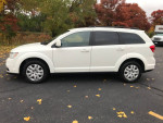Side view of a 2018 Dodge Journey SXT in excellent condition with 7 passenger seating.