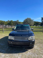 Front view of a dark blue 2006 Land Rover Range Rover HSE in good condition with a clear sky background.