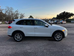 2013 Porsche Cayenne in white with tan interior, excellent condition, fully loaded features including navigation and sunroof.