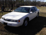 1994 Mercury Cougar V8 parked on grass with low mileage, well maintained and in excellent condition.