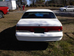 Rear view of a 1994 Mercury Cougar with low mileage, showcasing its well-maintained exterior and iconic design.