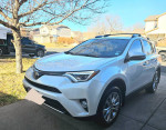2018 Toyota RAV4 Limited FWD in excellent condition, low mileage, parked outside on a sunny day.