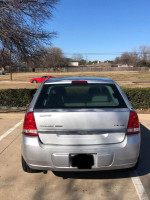 Rear view of a silver 2004 Chevrolet Malibu, showing no mechanical issues and new maintenance.