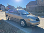 2007 Toyota Corolla SE in tan color parked on a residential street with clean exterior, good tires and one owner.