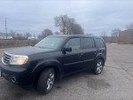 2014 Honda Pilot EX FWD in black on a parking lot with overcast sky, ideal for repair or parts.