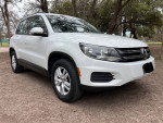 2016 Volkswagen Tiguan SE 4Motion AWD parked outdoors, showcasing clean white exterior and alloy wheels.