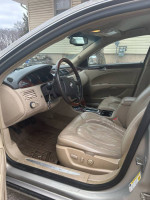 2009 Buick Lucerne CXL interior view highlighting spacious leather seats and elegant dashboard design.