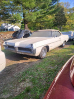 1967 Pontiac Catalina Convertible parked outdoors, showcasing its classic design and solid body condition.