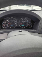 Dashboard view of a 2007 Jeep Grand Cherokee with speed and RPM gauges