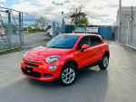 2016 Fiat 500X Easy Edition in orange, parked on a street with a clean, attractive exterior.