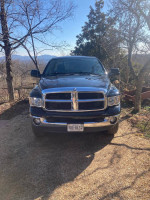 Front view of a well-maintained 2005 Dodge 2500 truck with 109,000 miles parked in a scenic outdoor setting.