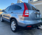 2008 Honda CR-V EXL AWD in blue color, showing rear view and sleek design.