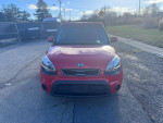 Front view of a red 2013 Kia Soul with clean exterior, available for sale with 86,800 miles and a clean CarFax.