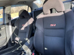 Interior view of a 2007 Honda Civic Si showing sport seats with SI branding, in good condition.