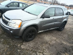 2005 Chevrolet Equinox LT AWD in gray, showcasing new detailing and mechanical repairs, parked on a gravel lot.