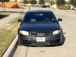 2007 Audi A4 2.0T FWD parked on the street, showcasing its sleek front design and modern detailing.