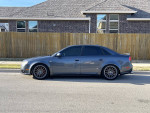 2007 Audi A4 2.0T FWD in gray parked on the street with custom wheels