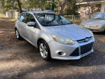 2013 Ford Focus S in silver color, well maintained, with a cracked windshield and good tires for sale.