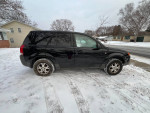 2004 Saturn Vue AWD in black, parked on snowy ground, needs front subframe repair, clean title