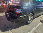 Damaged rear view of a 2009 Infiniti G37X AWD showing new parts and rear collision damage.