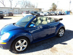 2007 Volkswagen Beetle convertible in blue with leather interior and tinted windows parked outdoors