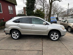 2008 Lexus RX 350 SUV in silver with leather interior, sunroof, and navigation, parked on a driveway.