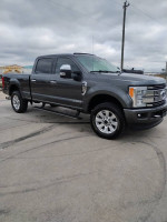 2017 Ford F250 Platinum truck with 98k miles, clean title, good condition, parked on a cloudy day.