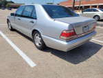 1999 Mercedes S420 parked with a silver exterior, showcasing recent maintenance and stylish design.