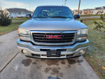 2006 GMC Sierra 1500 SLT front view, with original 5.3 engine and leather seats for sale, showing typical wear.