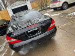 2008 Mercedes-Benz SL 550 convertible parked, showing rear view with smoke, needs repairs and services.